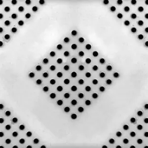 a black and white photo of a polka dot pattern on a white surface .