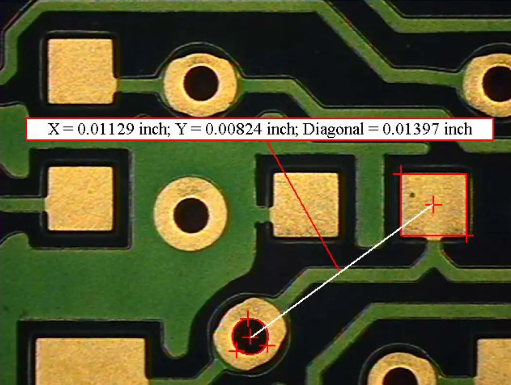 a close up of a circuit board with multiple measurements