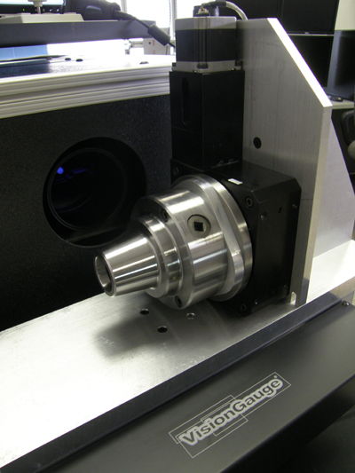 horizontally-mounted-rotary-stage Rotary stage mounted with the axis of rotation aligned horizontally with a 5C Collet chuck on VisionGauge® Digital Optical Comparator